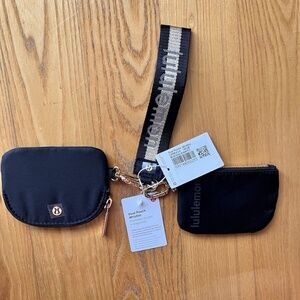 Brand new with tags Lululemon dual pouch keychain wristlet in black and gold